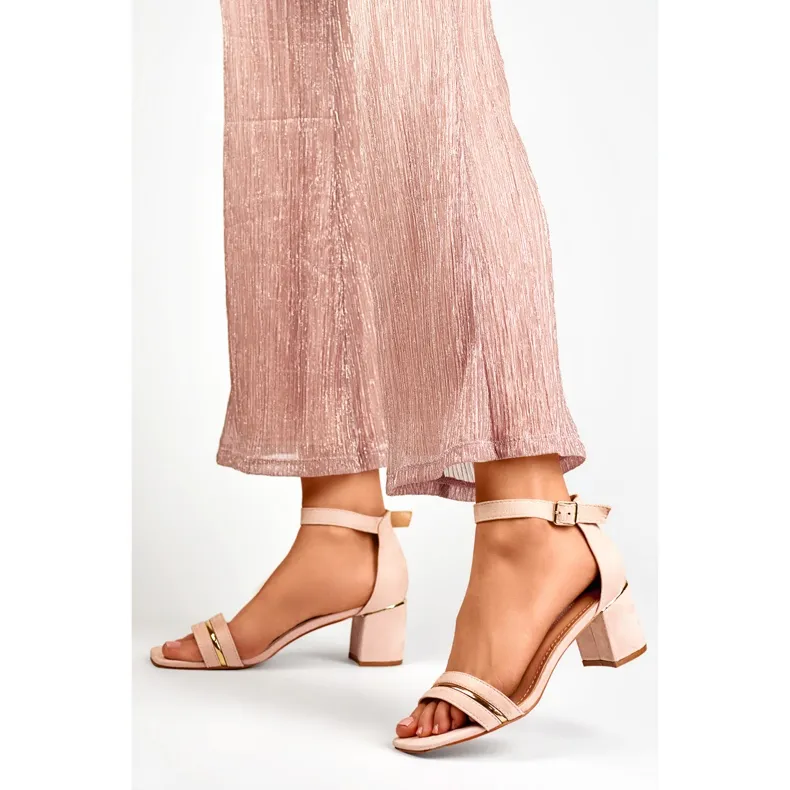 Pink women's low-heeled sandals with ankle fastening